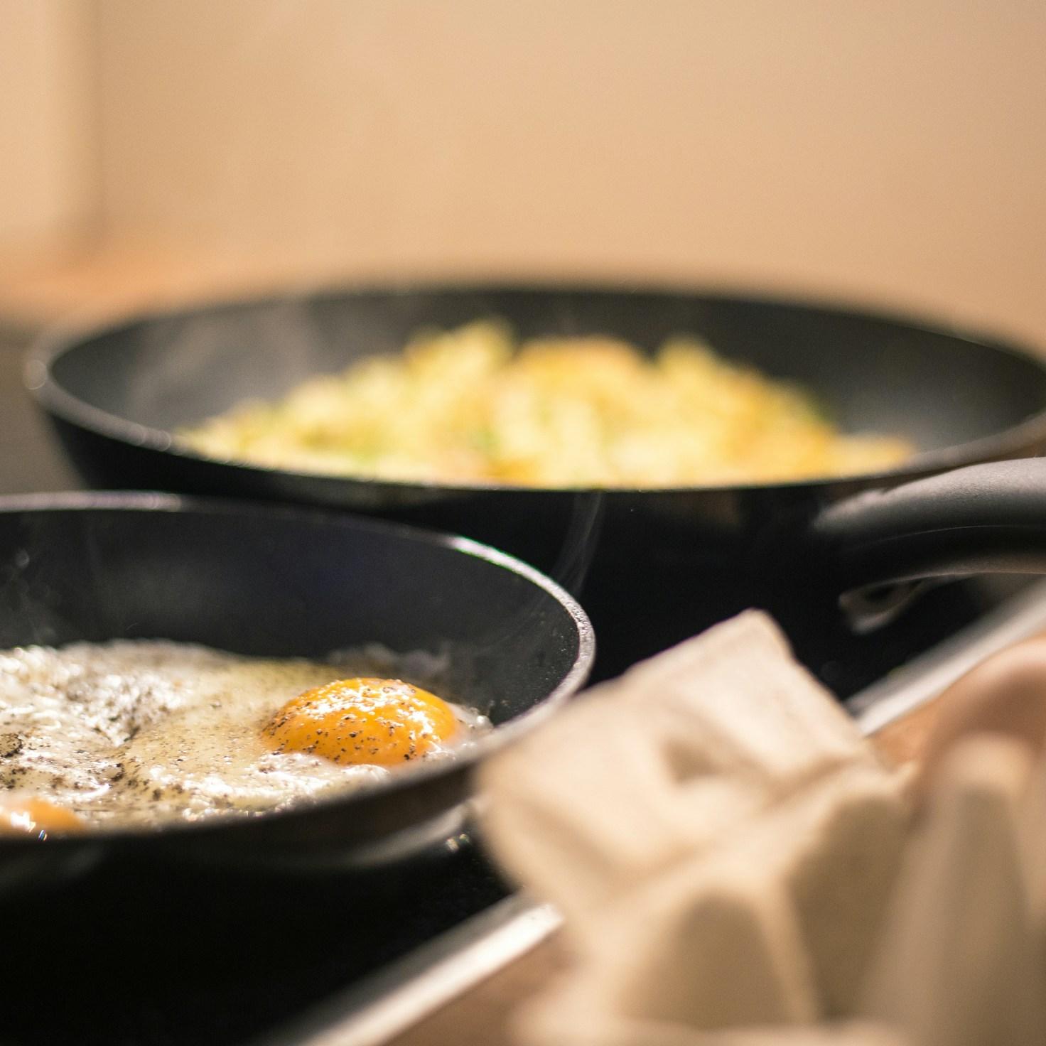 Community members collaborating in a modern kitchen space, sharing recipes and cooking techniques